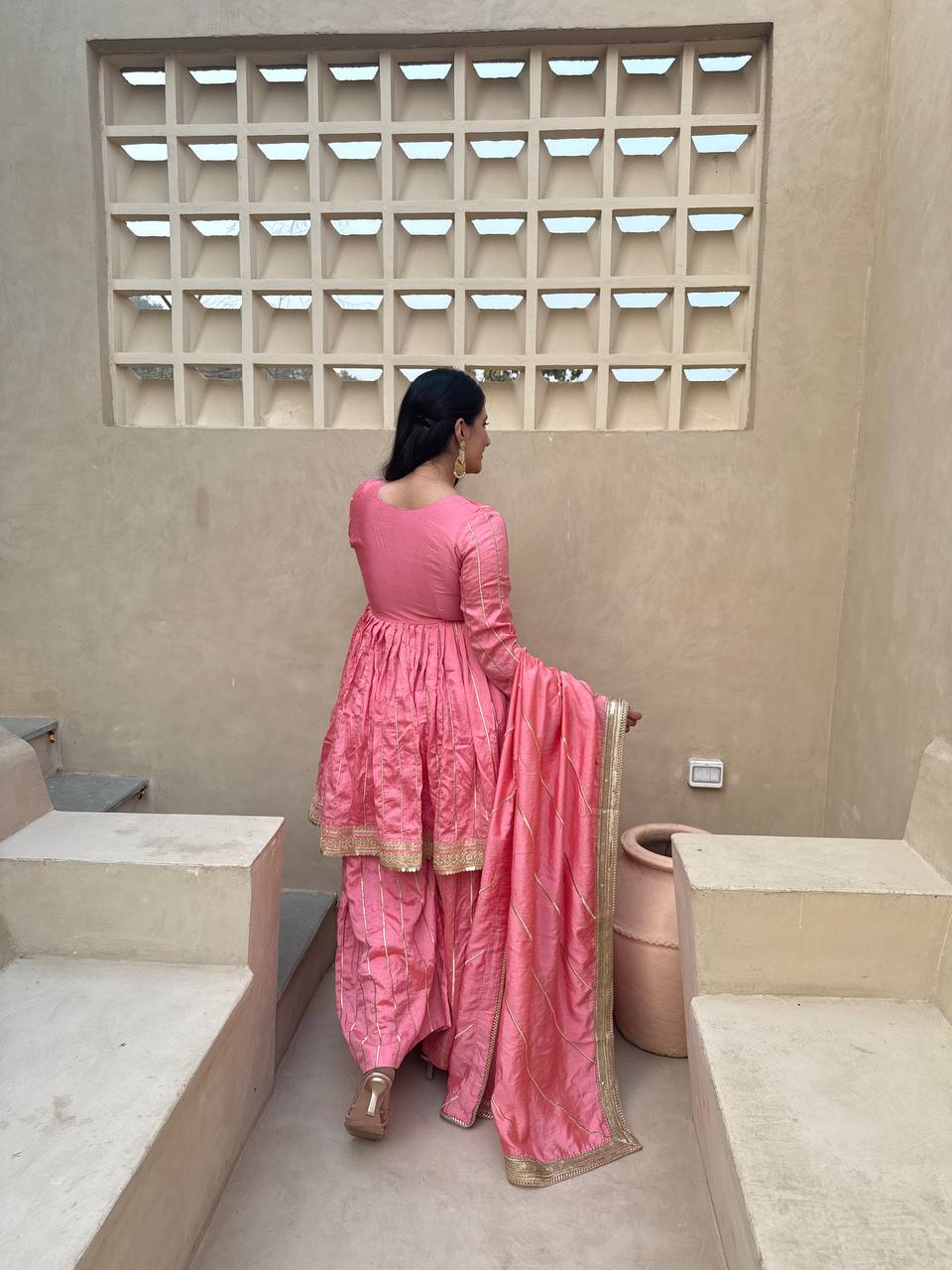 Radiant Rose Pink Flared Peplum Kurti and Sharara Set Embellished with Luminous Gold Zari Stripes and Sequined Borders